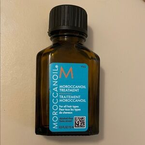 Opened. Mini Moroccanoil Treatment